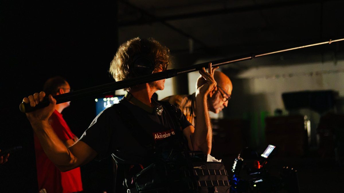 Frankie Richards operating a boom pole on set — production sound mixer in Dallas Fort Worth and Austin Texas